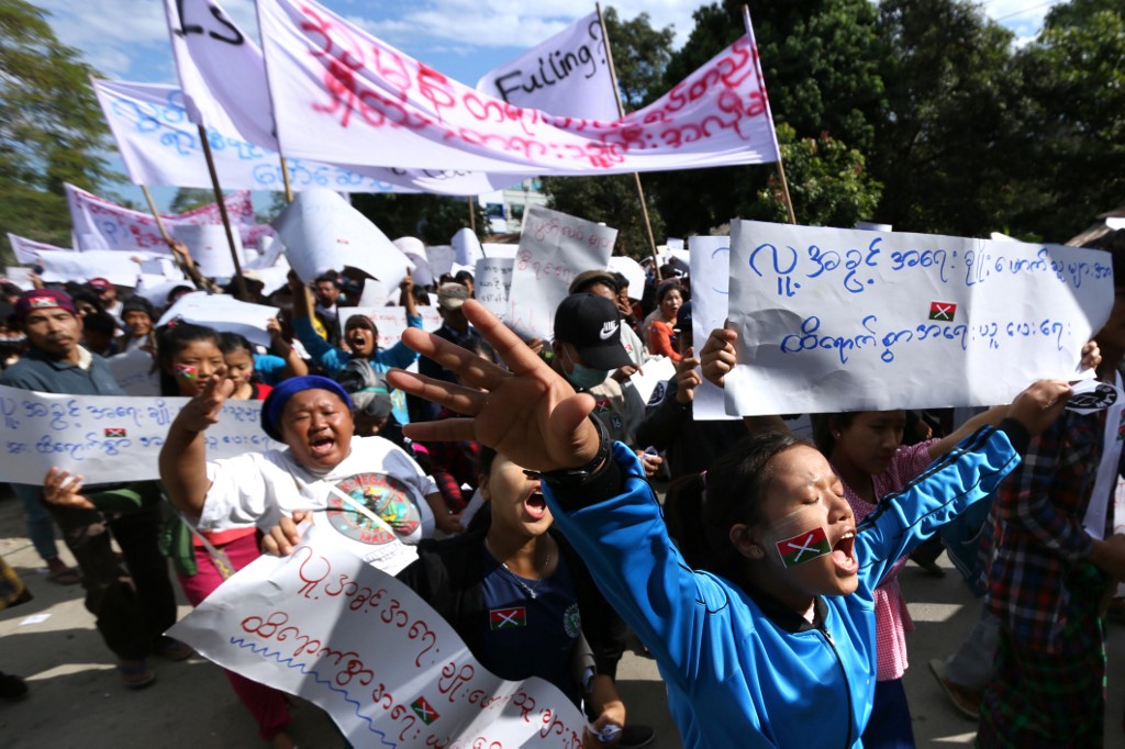 Demonstrators march in support of three local activists jailed by authorities during a rally in Myitkyina, capital of restive Kachin state on December 11, 2018. (Zau Ring Hpra / AFP)