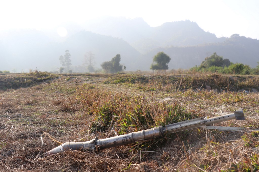  This photo taken on February 21, 2019 shows an unexploded ammunition lying on a field in Rathedaung township after fresh fighting in Rakhine state between the Myanmar military and the Arakan Army, an ethnic Rakhine force. (AFP)