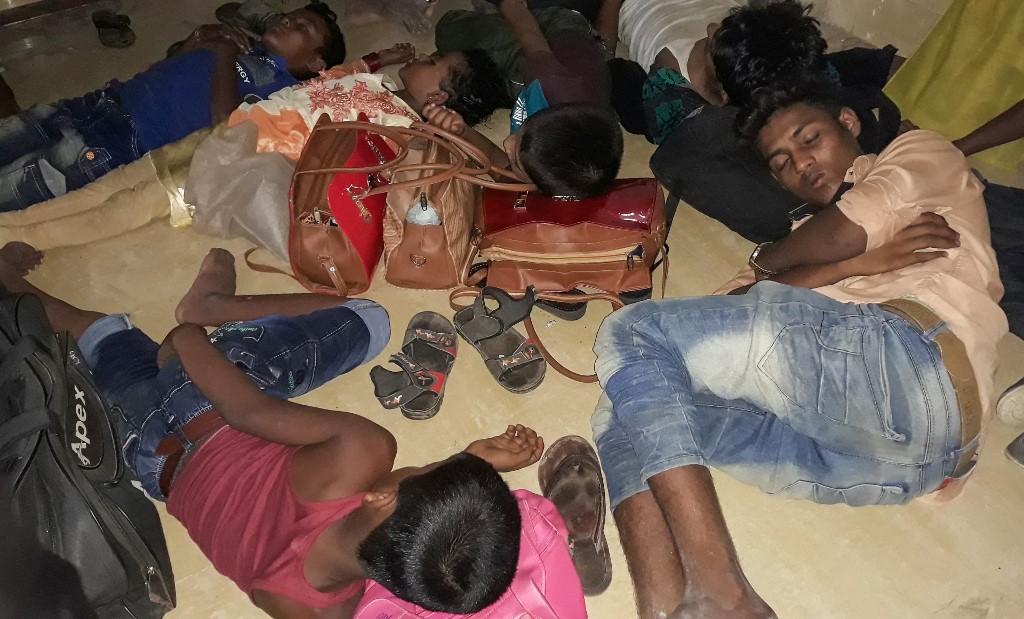  Young Rohingya refugees sleep in a police station before being returned to the camps in Cox’s Bazar on May 15, 2019, after they were rescued from going on a sea voyage to Malaysia. (Suzauddin Rubel / AFP)