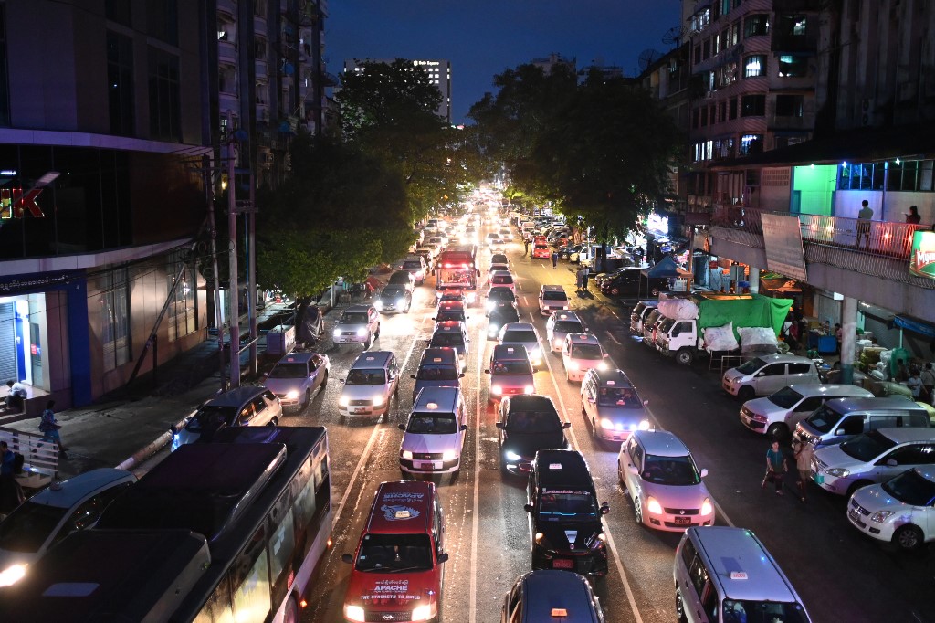 A general view of traffic in Yangon at night on June 19, 2019. Ye Aung THU / AFP