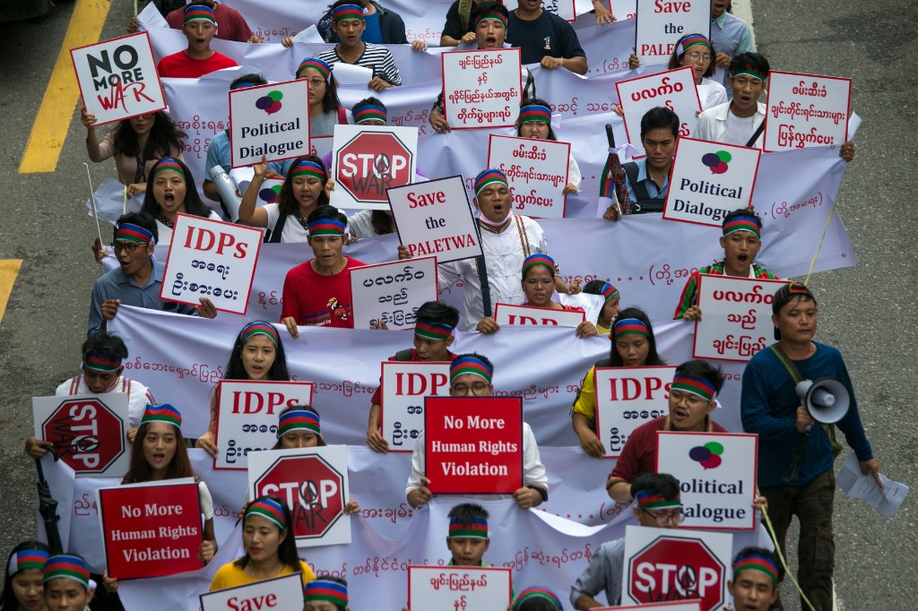 Ethnic Chin people hold placards during a protest asking for an end to conflict in Chin and Rakhine states in Yangon on July 13, 2019. (Sai Aung Main / AFP)