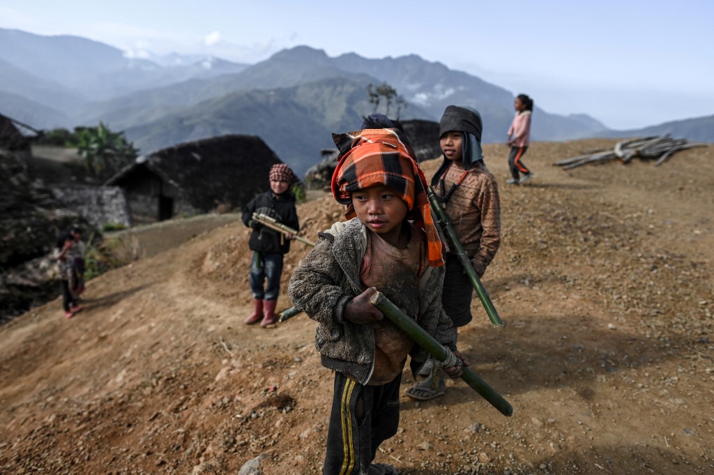 This photo taken on February 9, 2020 shows children playing in Karmawlawyi village in Myanmar's Sagaing region, near the border with India. (Ye Aung Thu / AFP)