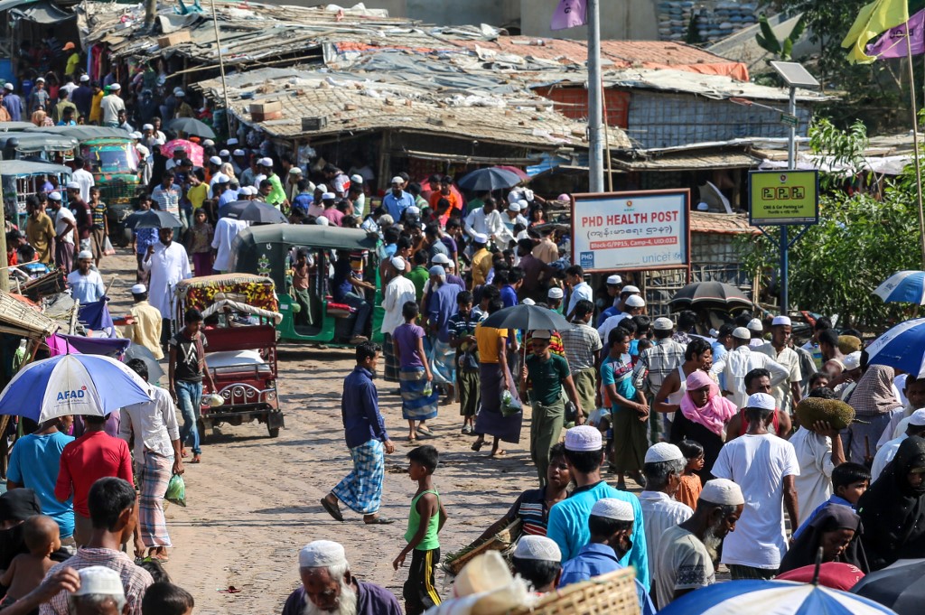 In this file photo taken on May 15, 2020 Rohingya refugees gather at a market as first cases of COVID-19 coronavirus have emerged in the area, in Kutupalong refugee camp in Ukhia. (Suzauddin Rubel / AFP)