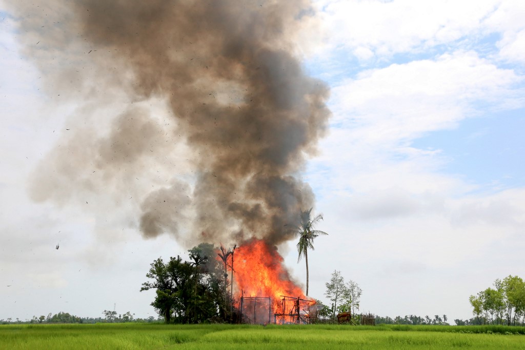 In this file photo taken on September 7, 2017, a house burns in Gawdu Tharya village near Maungdaw in Rakhine state. (AFP)