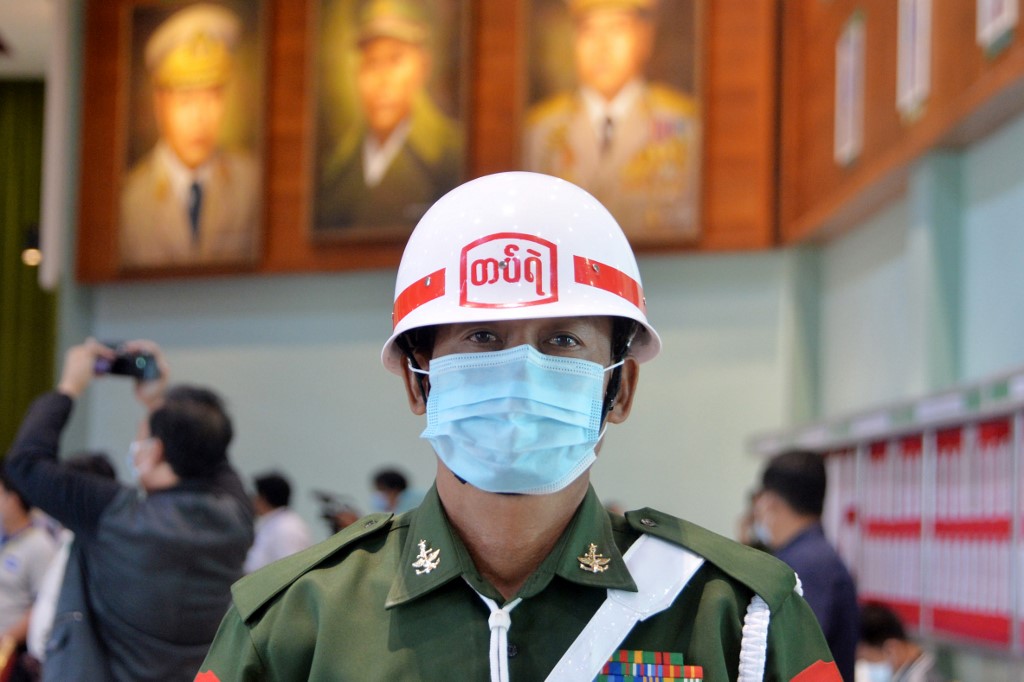 A military officer stands guard during a press briefing at the Defence Service Museum in Naypyidaw on January 26, 2021. (Thet Aung / AFP)