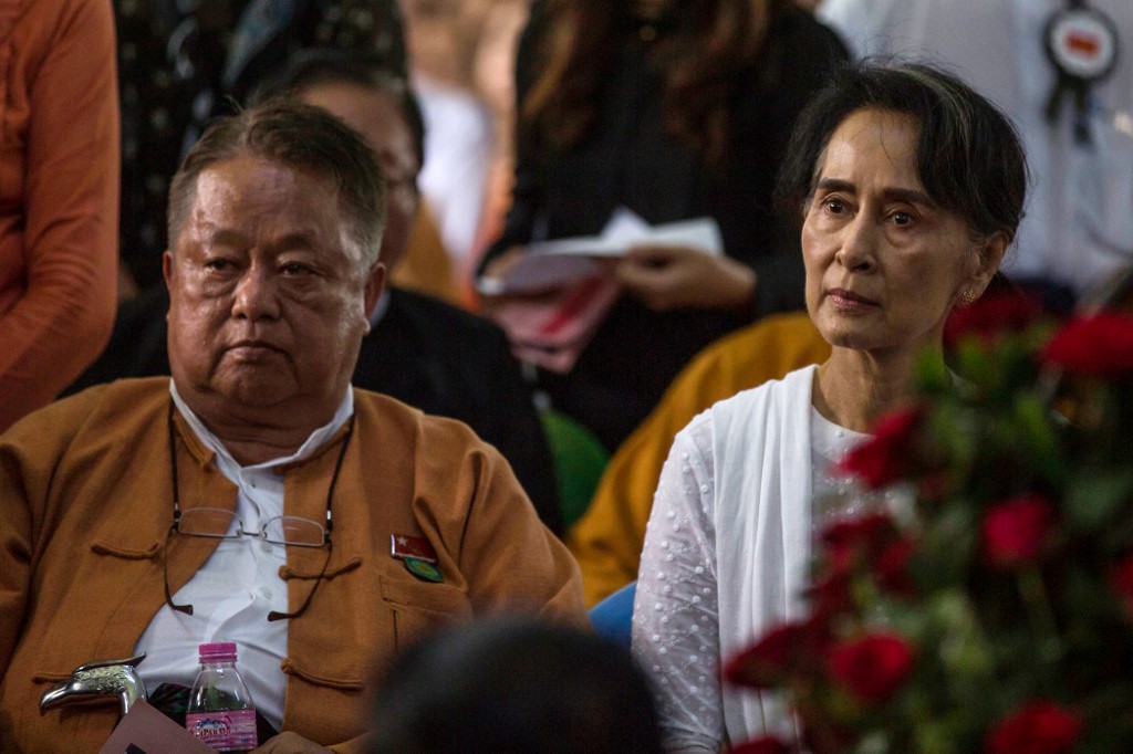 This file photo taken on August 17, 2017 shows Win Htein (L), chief executive committee member of the National League for Democracy (NLD) and a key aide to Myanmar's State Counselor Aung San Suu Kyi (R), attending the funeral service of the NLD party's former chairman Aung Shwe in Yangon. A key aide of Myanmar's ousted leader Aung San Suu Kyi was arrested in the early hours of February 5, 2021, a press officer from her National League for Democracy (NLD) party said. (STR)        