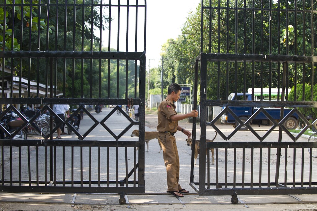 A guard closes a gate leading to Myanmar's Insein prison. (Ye Aung Thu / AFP)
