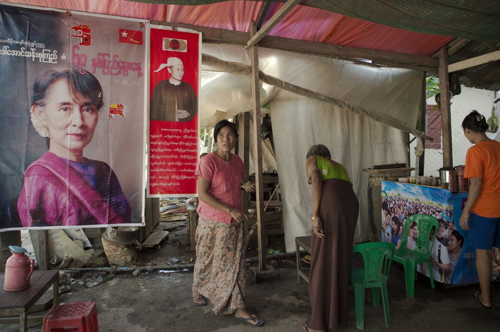  A poster bearing a portrait of Myanmar opposition leader Aung San Suu Kyi (L) is seen at a tea and coffee shop in Yangon on November 12, 2015.. (Nicolas Asfouri / AFP)