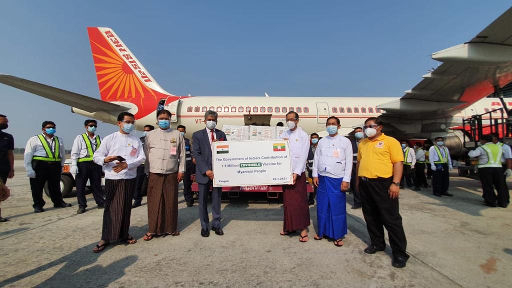  Indian ambassador Shri Saurabh Kumar (left) and Dr Zaw Than Tun of Myanmar’s Medical Research Department (right) with the batch of Covishield vaccines at Yangon International Airport on January 22. (Pe Zaw)