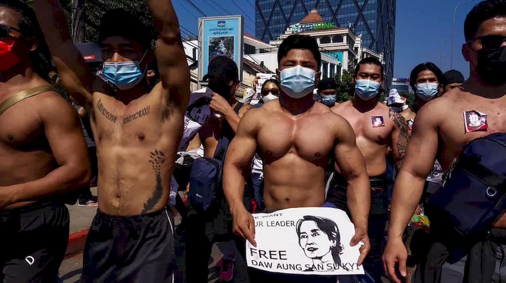 The fitness fanatics were among tens of thousands in Yangon undeterred from hitting the streets. (AFP)