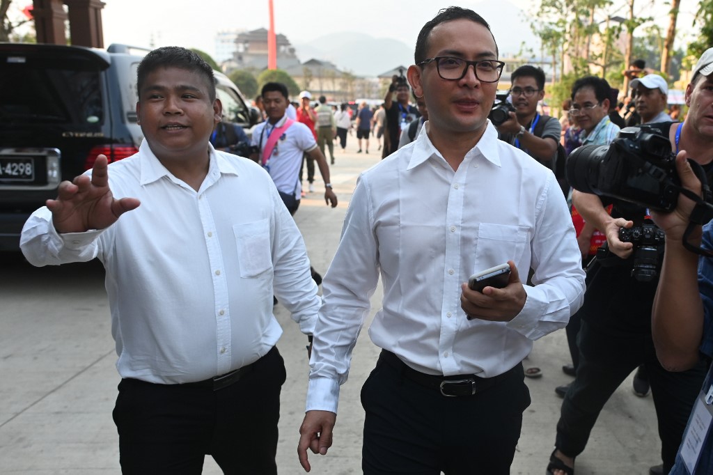 Tun Myat Naing (R), commander-in-chief of the Arakan Army (AA), and Nyo Tun Aung, AA's second-in-command, arrive for a welcome dinner, organised to commemorate the 30th anniversary of peace-building efforts in Wa State, in Panghsang on April 16, 2019. (Ye Aung Thu / AFP)