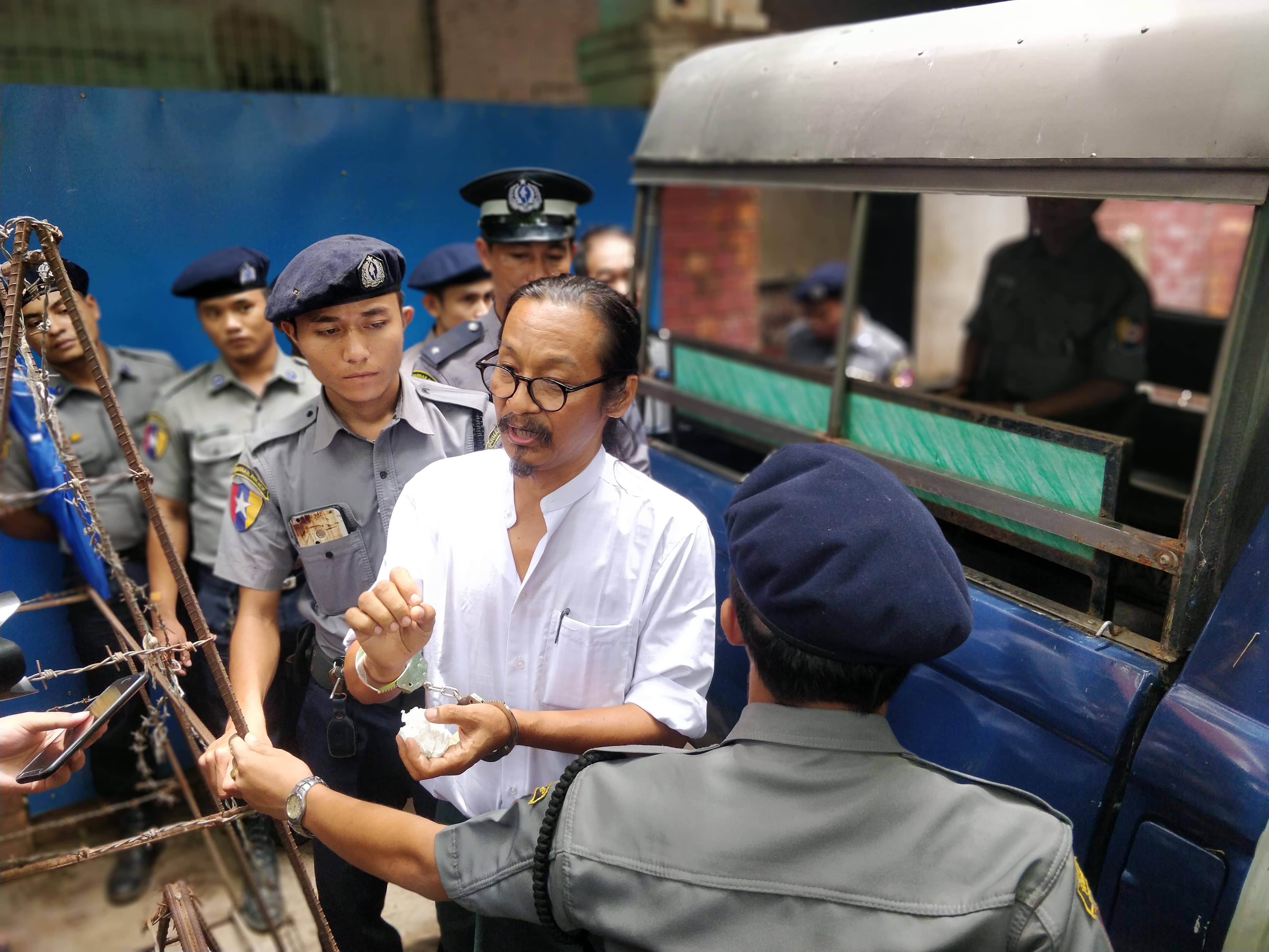 Mint Htin Ko Ko Gy speaks to media outside Insein township court on June 6. (Myanmar Mix)