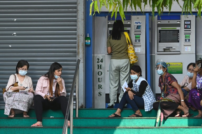 People in Myanmar have been queueing anxiously at banks after the coup as a strict new limit on daily withdrawals fuelled rumours of a money shortage. (Sai Aung Main / AFP)