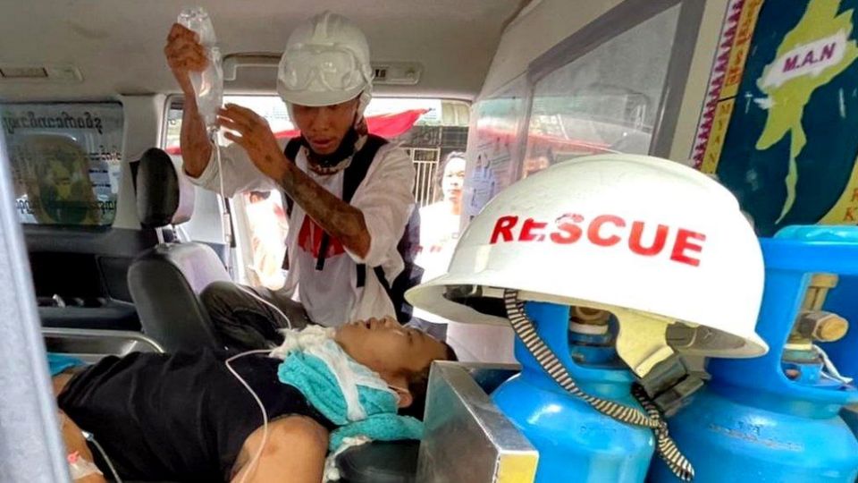 A wounded man is treated in an ambulance near Hledan Junction. (Supplied)