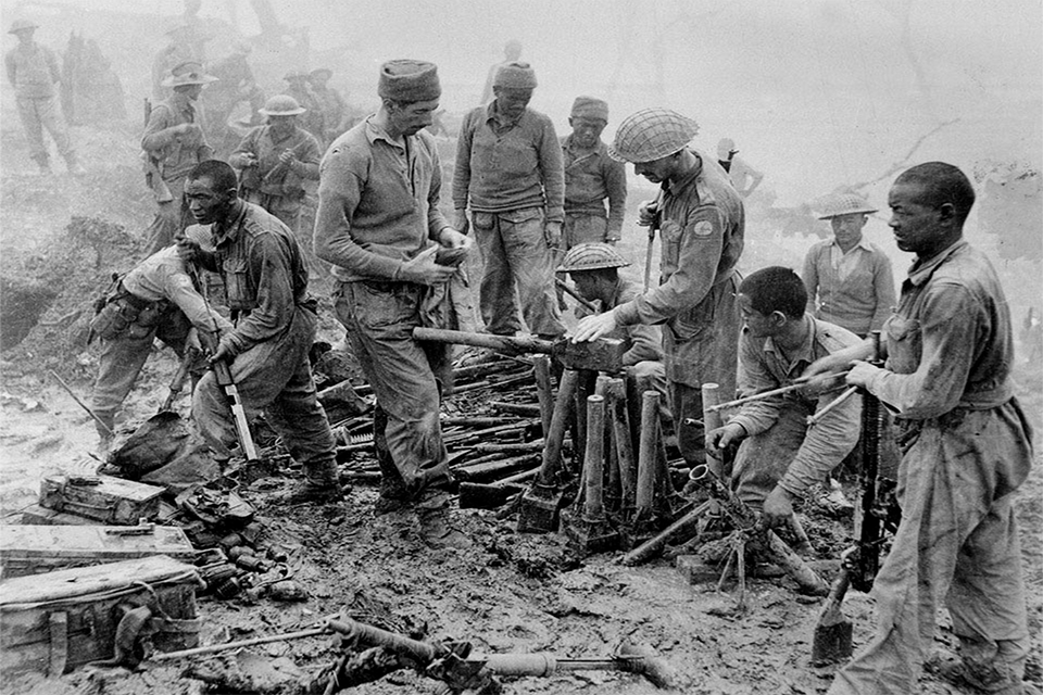 Indian and Gurkha soldiers inspect captured Japanese ordnance during the Imphal-Kohima battle, 1944. (The National Archives UK)