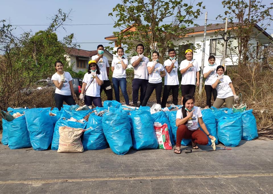 Clean Yangon members tidy trash in Hlaingthaya township. (Clean Yangon / Facebook)