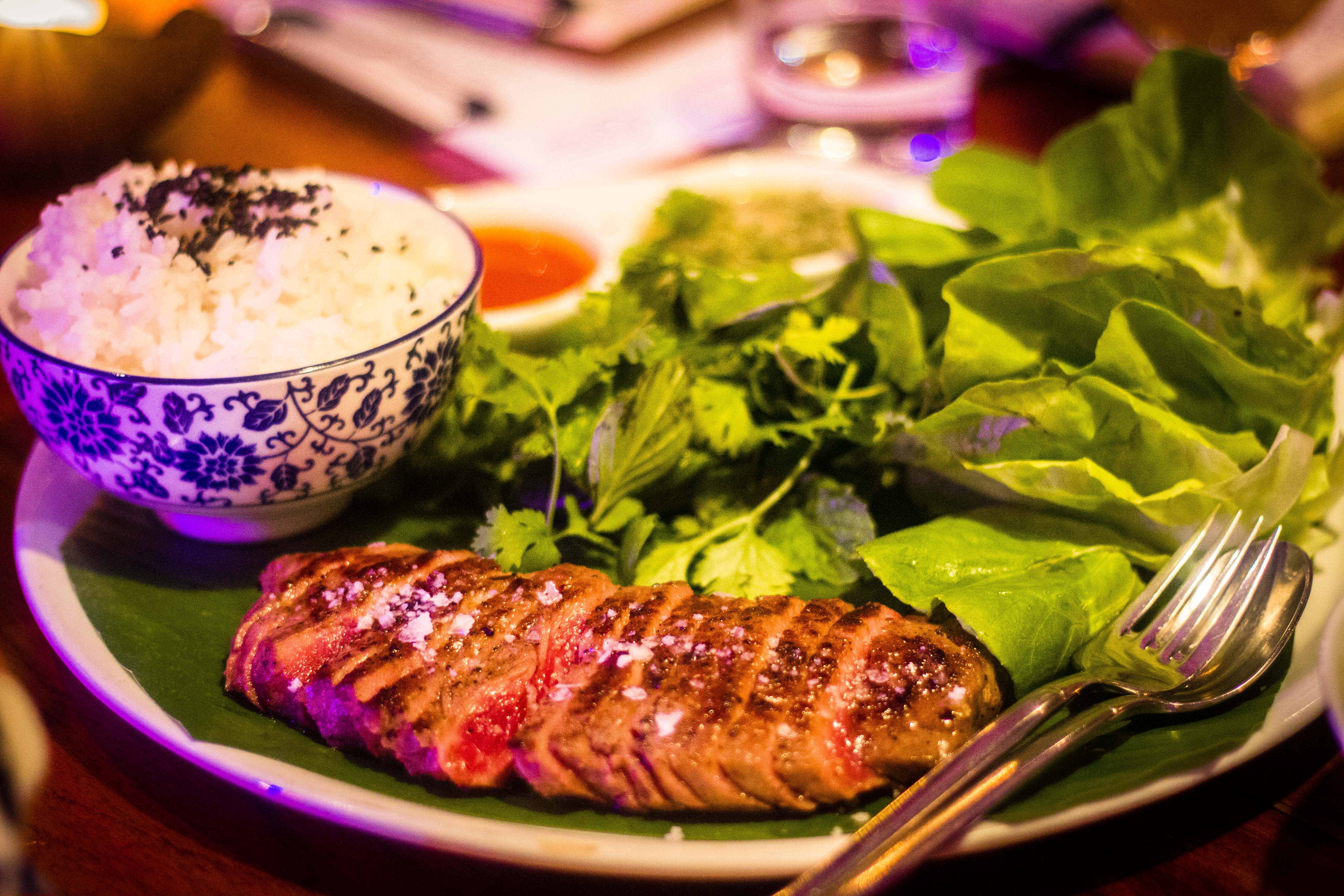 The PA Steak is a spread of nam pla-aged striploin that is served Ssam style with lettuce leaf wraps, fresh herbs and spicy Korean sauces. (Leo Jackson)