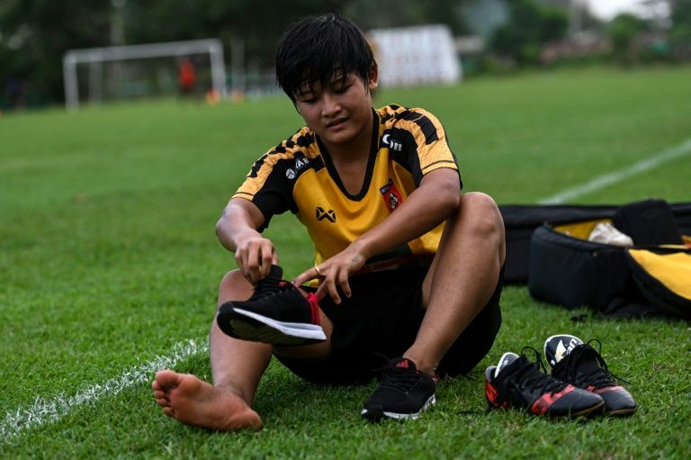 San Thaw Thaw fled from her family's paddy fields to follow her footballing dreams, inspired by her girlhood hero Wayne Rooney. (Ye Aung Thu / AFP)