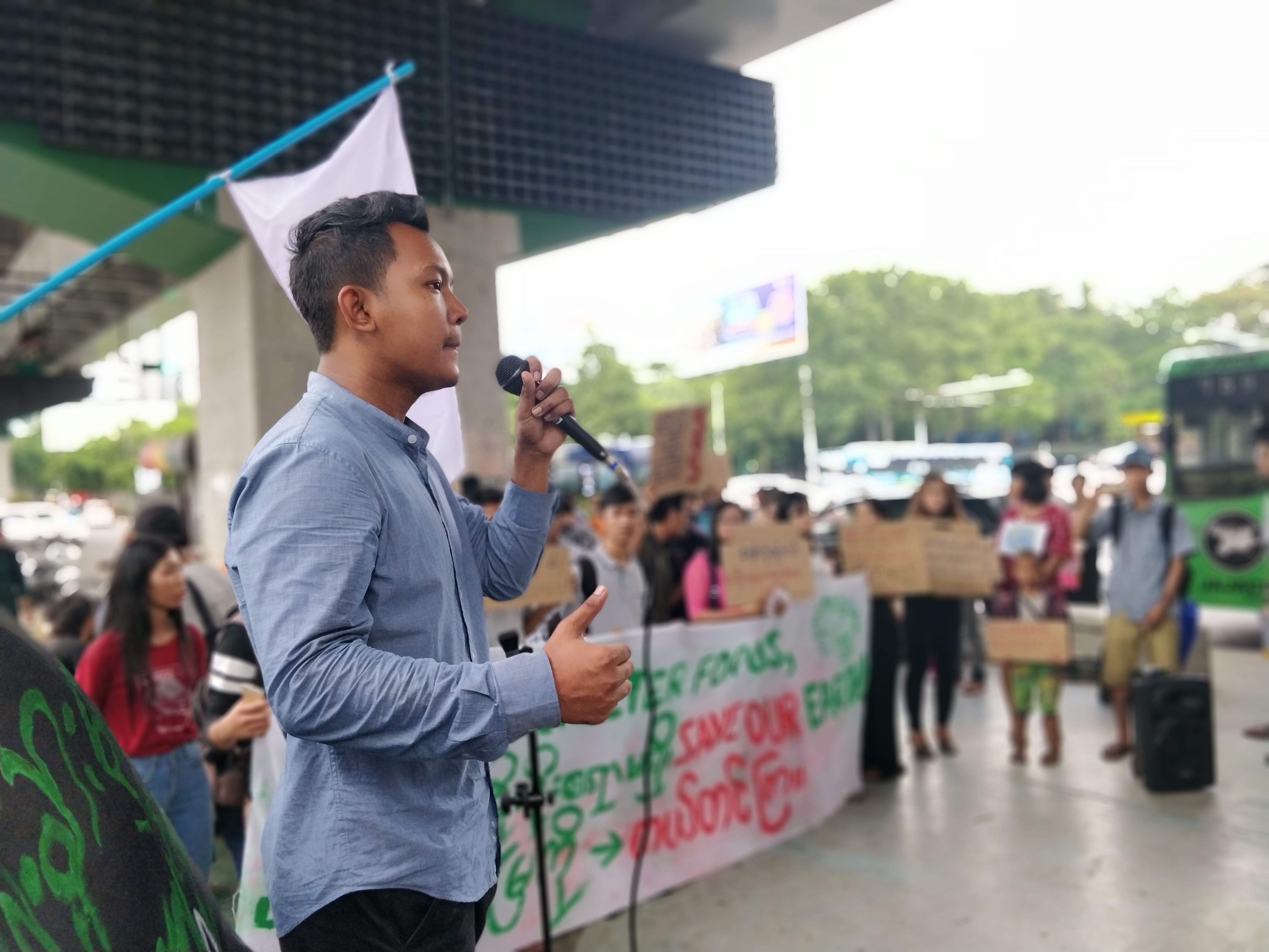 Psychology student Kyaw Ye Htet, who helped start Fridays for Future Myanmar, talks to the rally on Friday, May 31. (Myanmar Mix)