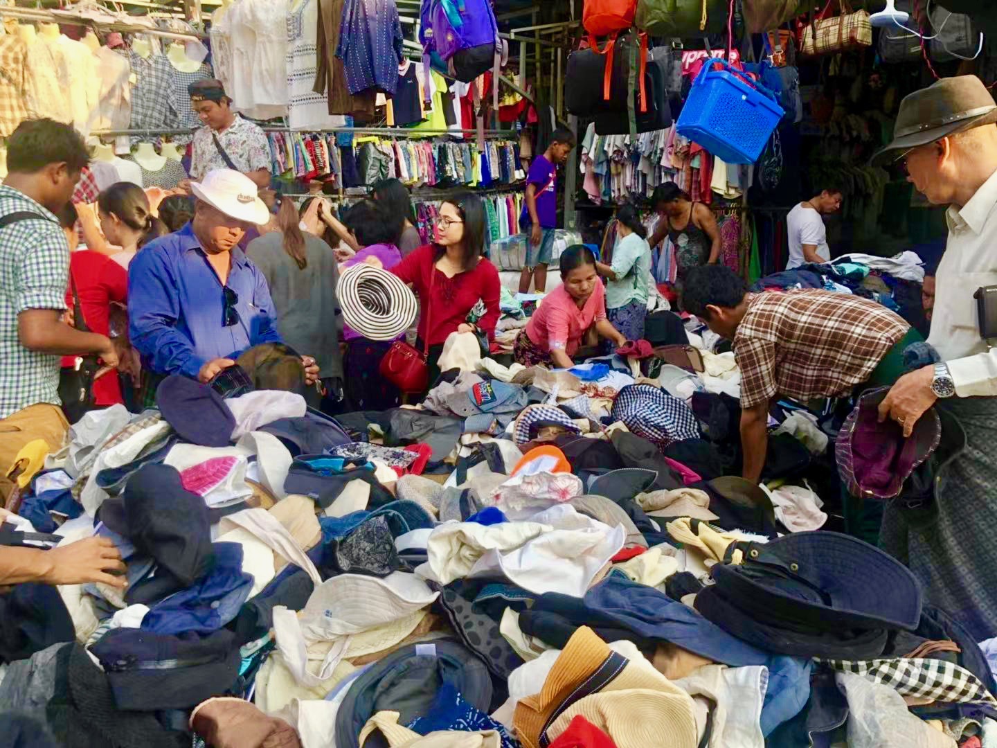 Shoppers crowd at a stall on the Zay Gyi Street market. (Rita Shan)