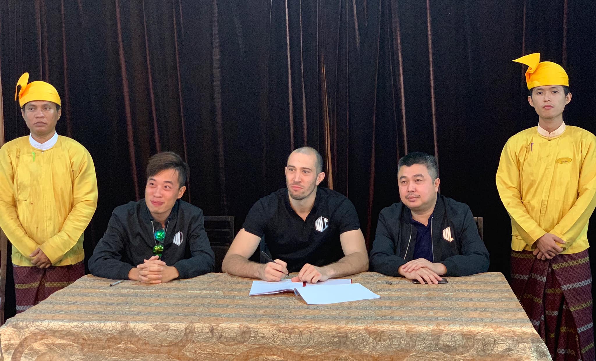 Dave Leduc (middle) signs with World Lethwei Championship on Saturday, March 9. (WLC / Facebook)