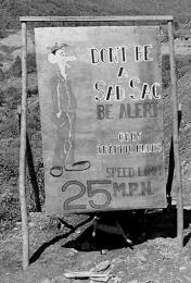  “Don’t be a sad sac – be alert – obey traffic rules – speed limit 25 M.P.H.”
