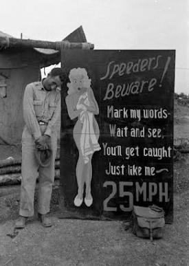 The previous sign, perhaps before it was put out on the road.