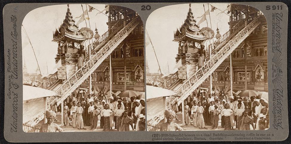 Splendid honors to a dead Buddhist - elevating coffin in car to a gilded shrine in Mandalay.