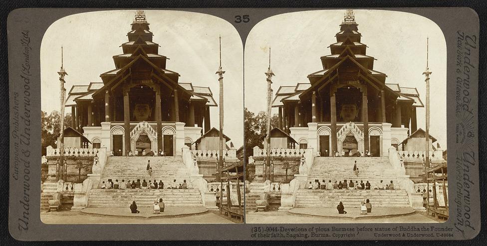 Devotions of pious Burmese before statue of Buddha in Sagaing.