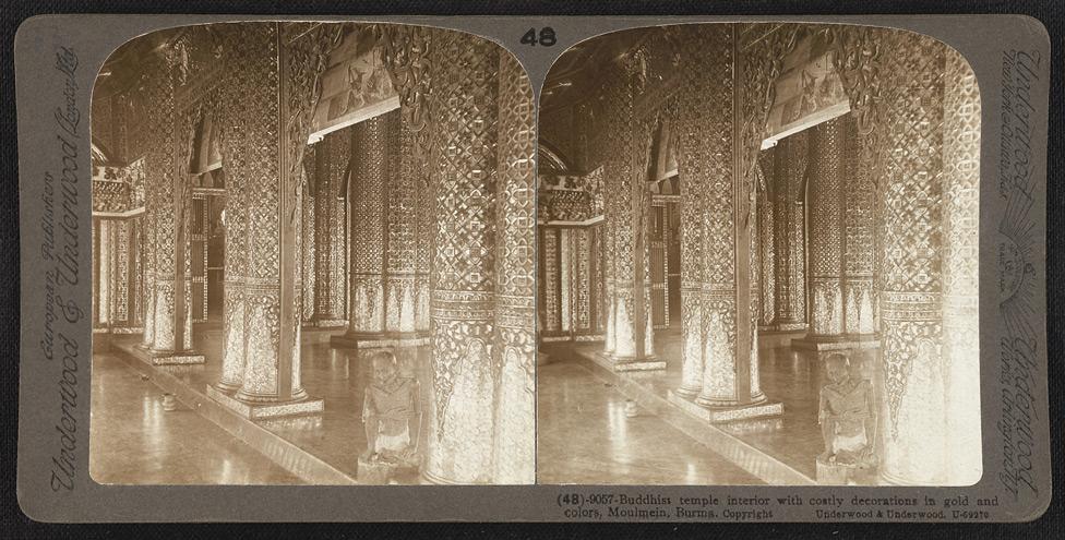 Buddhist temple interior with decorations in gold and colors, Moulmein.