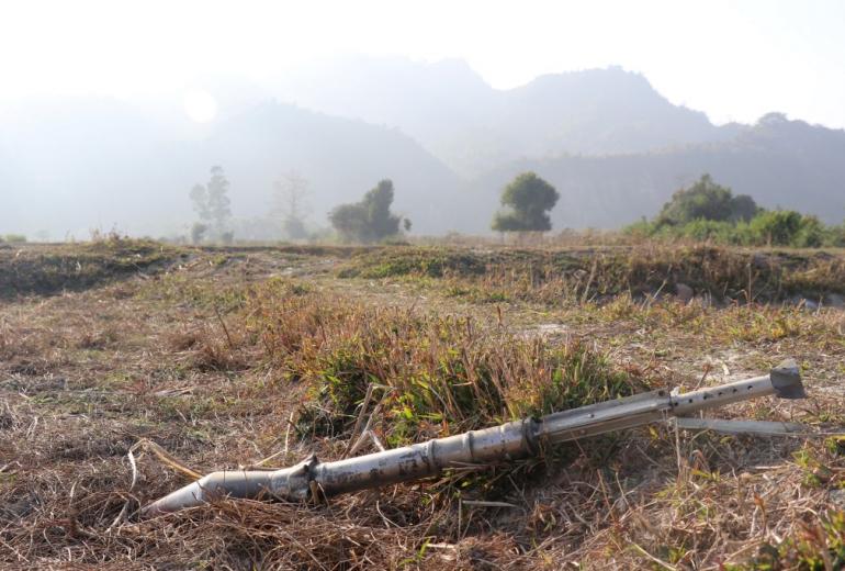  This photo taken on February 21, 2019 shows an unexploded ammunition lying on a field in Rathedaung township after fresh fighting in Rakhine state between the Myanmar military and the Arakan Army, an ethnic Rakhine force. (AFP)