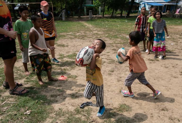 Players from the Little Dragons rugby team taking part in a training session in the North Dagon township, located on the outskirts of Yangon. (Sai Aung Main / AFP)