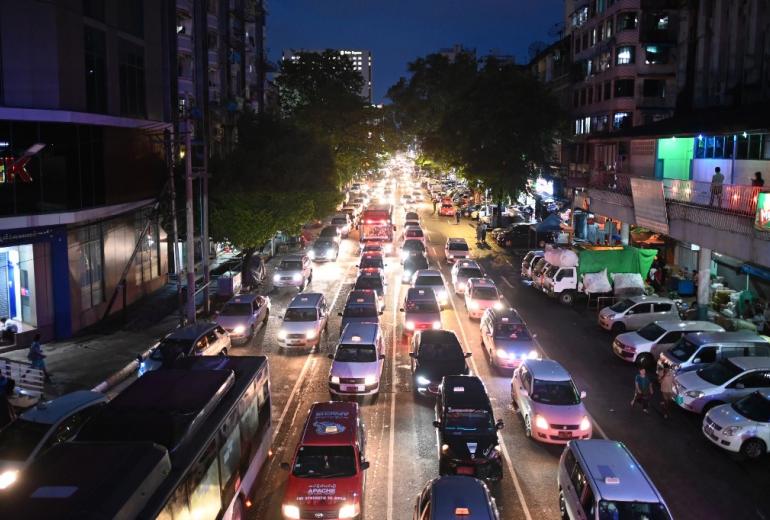 A general view of traffic in Yangon at night on June 19, 2019. Ye Aung THU / AFP