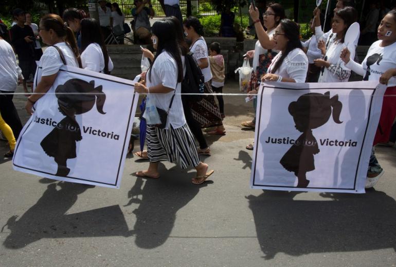 Protesters walk to the Central Investigation Department (CID) during the demonstration demanding justice for a two-year-old who was raped and given the pseudonym "Victoria" in Yangon on July 6, 2019. (Sai Aung Main / AFP)