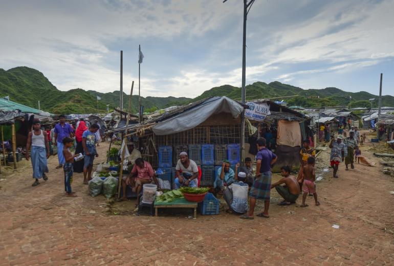 A Rohingya man sells betel leaves in a market at a camp in Teknaf on August 21, 2019. (Munir Uz Zaman / AFP)