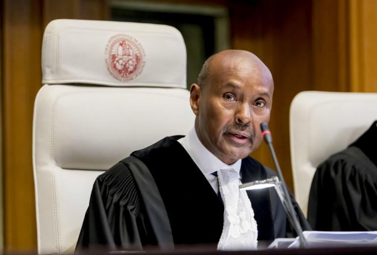 A handout photo released on December 10, 2019 by the International Court of Justice shows International Court of Justice (ICJ) Judge and court president Abdulqawi Ahmed Yusuf speaking during the case of The Gambia v. Myanmar at the Peace Palace in The Hague. (Frank Van Beek / UN / ICJ/ AFP)