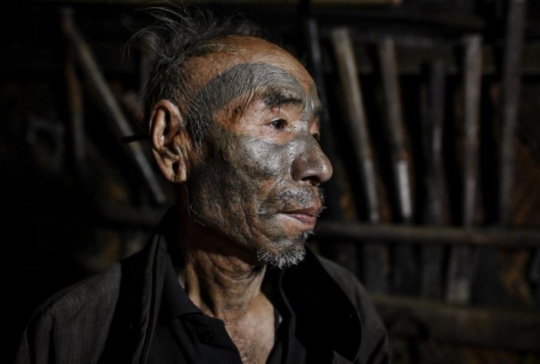  This photo taken on February 9, 2020 shows Nok Tan, 75, a tattooed Konyak tribeman, in his house in a village in Sagaing region of Myanmar, wedged in a semi-autonomous zone near the Indian border. (Photos by Ye Aung Thu / AFP)