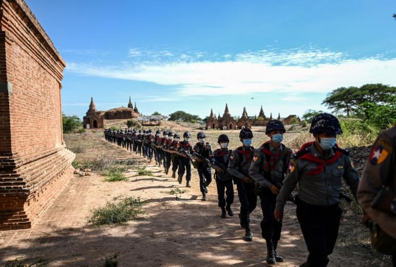 This photo taken on June 23, 2020 shows members of a police squad patrolling pagodas in a temple complex in Bagan, Mandalay Region. (Ye Aung Thu / AFP)