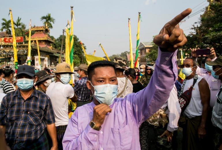 Military supporters take part in a protest to demand an inquiry to investigate the Union Election Commission (UEC) in Yangon on January 29, 2021, as fears swirl about a possible coup by the military over electoral fraud concerns. (Sai Aung Main / AFP)