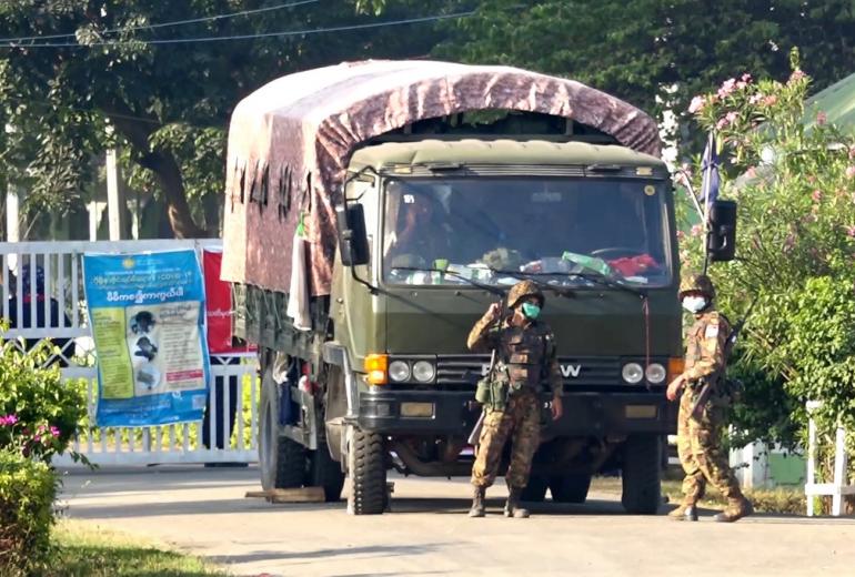 This screengrab taken from AFPTV video footage shows soldiers at the entrance to a guesthouse, where members of parliament reside at, in the country's capital Naypyidaw on February 2, 2021, as Myanmar's generals appeared in firm control a day after a surgical coup that saw democracy heroine Aung San Suu Kyi detained. (STR / AFPTV / AFP)