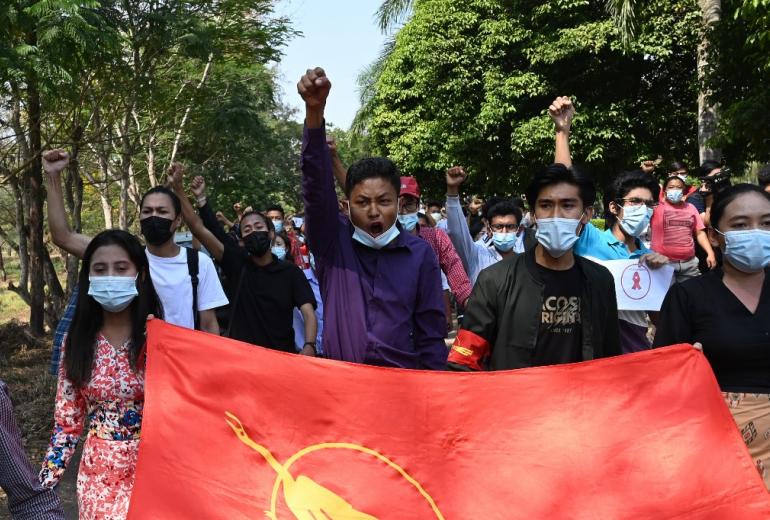 Students march during a protest against the military coup at Dagon University in Yangon on February 5, 2021. (STR / AFP)