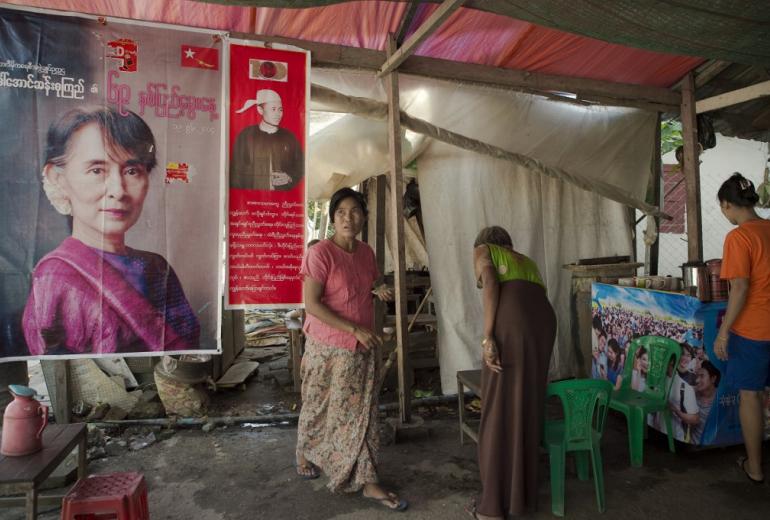  A poster bearing a portrait of Myanmar opposition leader Aung San Suu Kyi (L) is seen at a tea and coffee shop in Yangon on November 12, 2015.. (Nicolas Asfouri / AFP)