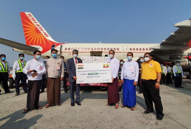  Indian ambassador Shri Saurabh Kumar (left) and Dr Zaw Than Tun of Myanmar’s Medical Research Department (right) with the batch of Covishield vaccines at Yangon International Airport on January 22. (Pe Zaw)