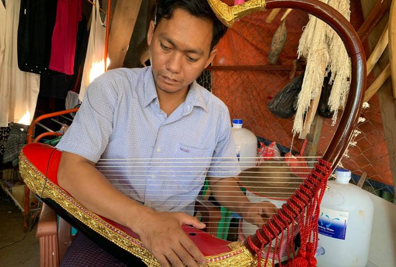 Aye Aung Win, who works in North Okkalapa township, began learning to make traditional Burmese harps when he was in fourth grade. (Photos and video by Nay Chi Nway) 