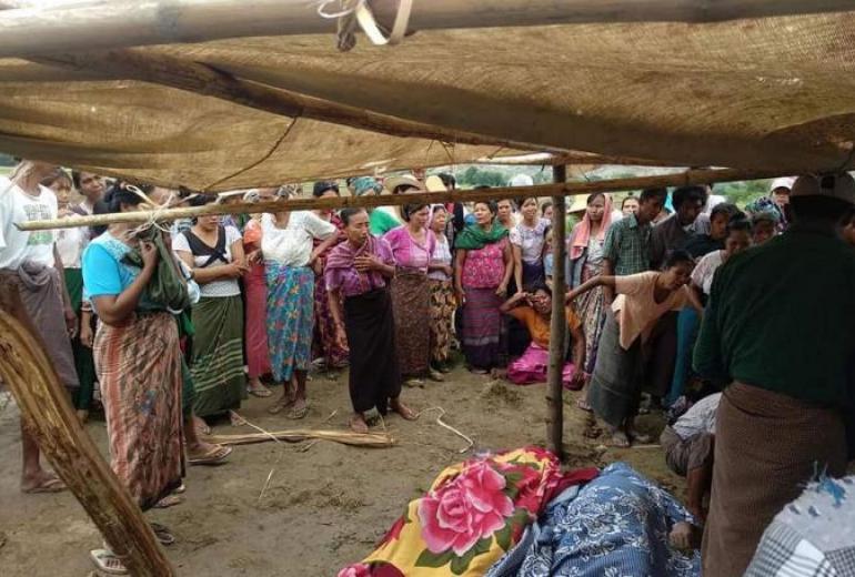  Villagers watch as bodies are recovered from the Irrawaddy River in Magway following the clashes. (Magway Region Fire Department)