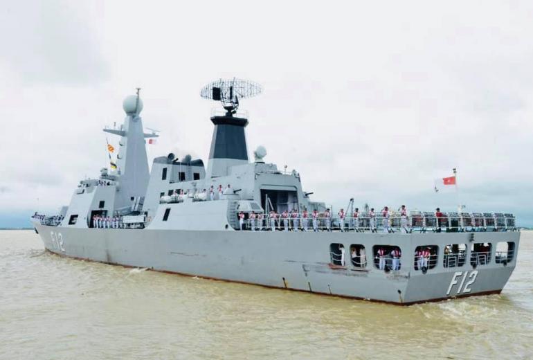 Naval officers wave from a warship as they leave Yangon on August 26. (Facebook / Myanmar navy)