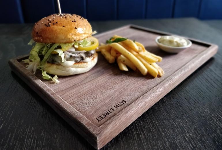 The 50th Street Bar Burger is a sample of the pub grub offered in the Yangon favourite. (Photos by Iryna Kyrylenko / Myanmar Mix)