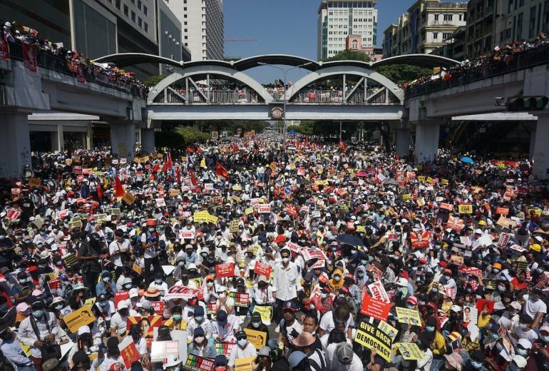 Protesters block a major road during a demonstration against the military coup in Yangon on February 17, 2021. (Sai Aung Main / AFP)