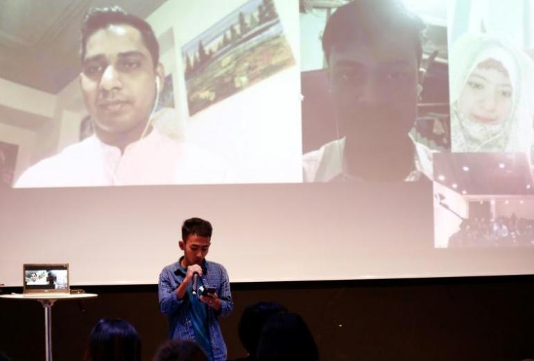 Rohingya Muslim poets recite poems via a video link during the "Poetry for Humanity" event in Yangon. (Sai Aung Main / AFP)