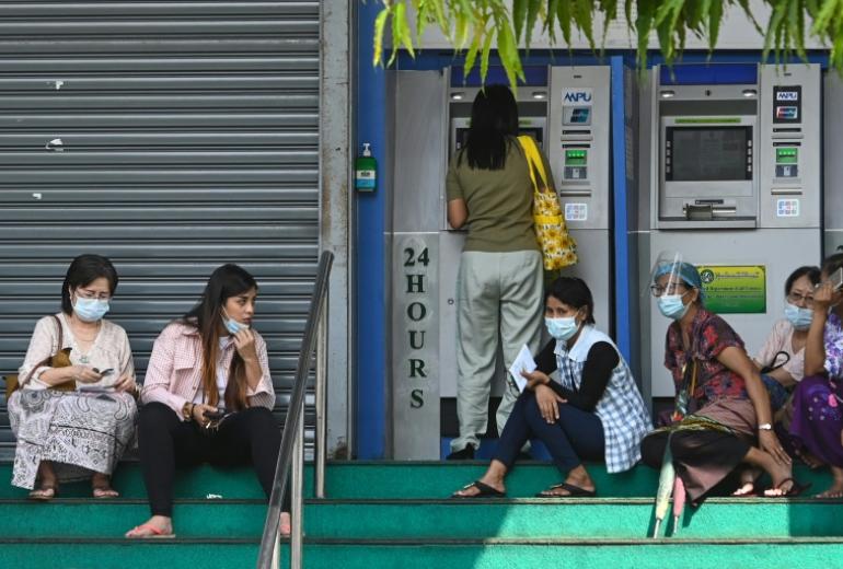 People in Myanmar have been queueing anxiously at banks after the coup as a strict new limit on daily withdrawals fuelled rumours of a money shortage. (Sai Aung Main / AFP)